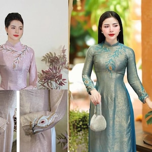 May include: Two long-sleeved dresses with mandarin collars. One is a light pink with embroidered floral details, the other is teal with peacock feather embroidery. Both dresses have a subtle sheen and are floor-length.