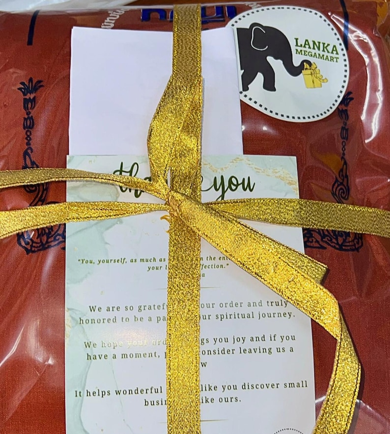 May include: A red gift bag with a gold ribbon tied around it. The bag has a thank you card with the text "You, yourself, as much as your affection." and "We are so grateful and honored to be a part of your spiritual journey. We hope you enjoy our offerings and if you have a moment, consider leaving us a review. It helps wonderful businesses like you discover small businesses like ours."