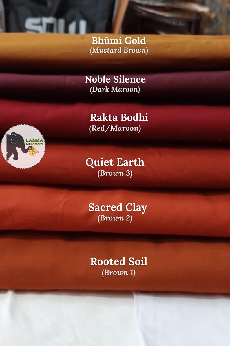 May include: A stack of fabric samples in shades of brown and maroon. The colors are labeled: Bhumi Gold (Mustard Brown), Noble Silence (Dark Maroon), Rakta Bodhi (Red/Maroon), Quiet Earth (Brown 3), Sacred Clay (Brown 2), and Rooted Soil (Brown 1).