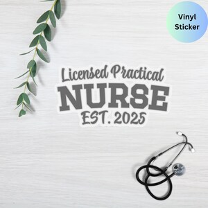 May include: Grey vinyl sticker with the text "Licensed Practical NURSE EST. 2025". The sticker is on a light wood surface with a stethoscope.