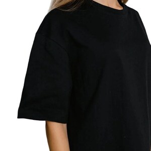 May include: A black short-sleeved t-shirt with a crew neck.