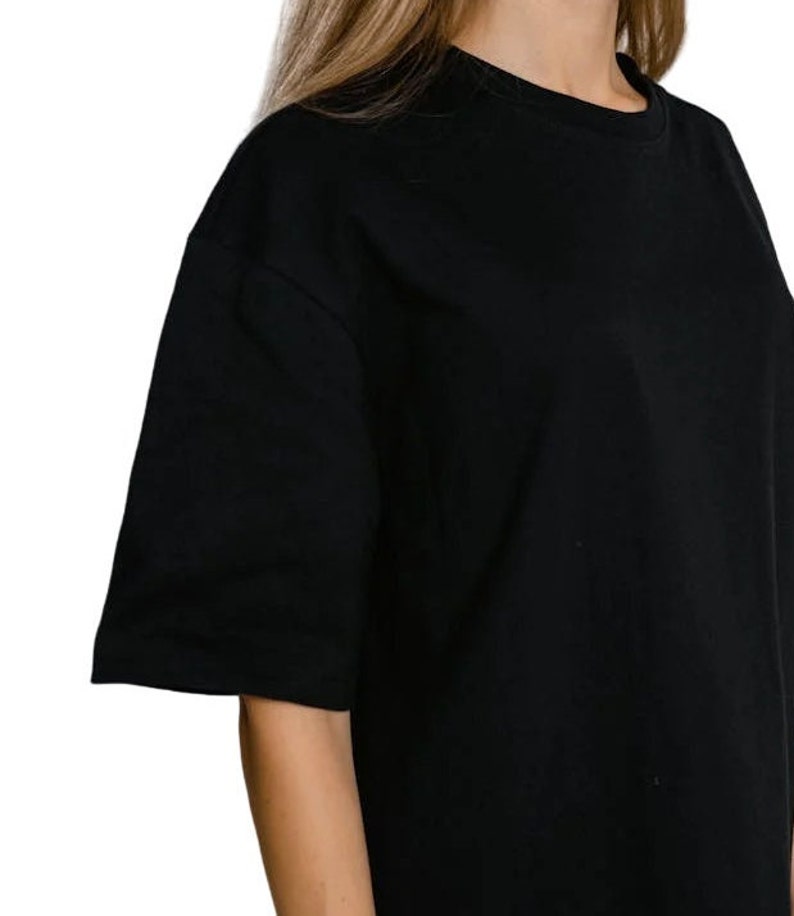 May include: A black short-sleeved t-shirt with a crew neck.