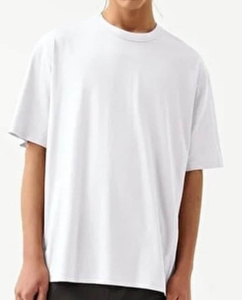 May include: A white oversized t-shirt with a crew neck.