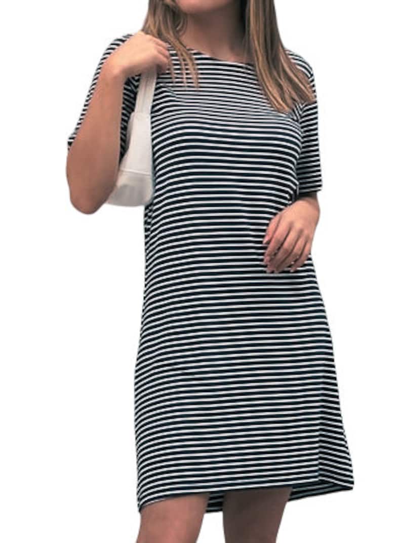 May include: A black and white striped short-sleeved dress with a round neckline.