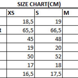 May include: Size chart in centimeters for clothing, showing measurements for shoulder, height from shoulder, hem, arm house, chest, sleeve length, and sleeve cuff. Sizes include XS, S, M, L, and XL.