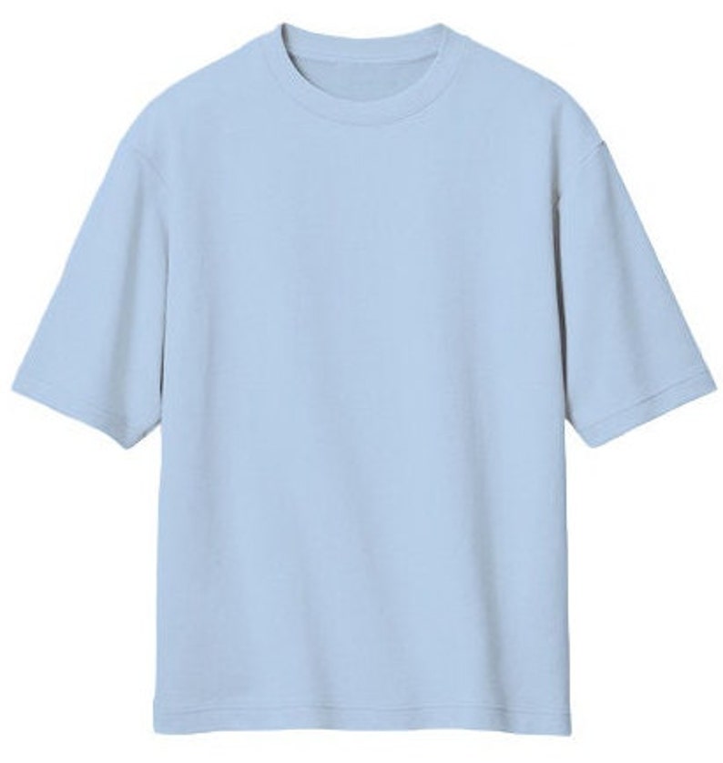 May include: A light blue short-sleeved t-shirt.