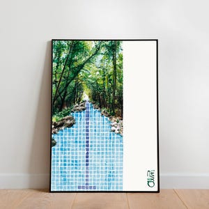 May include: A watercolor painting of a forest path leading to a blue tiled pool. The path is lined with trees and rocks. The painting is framed in black.