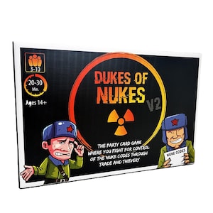 May include: A boxed party card game titled "Dukes of Nukes V2." The box features cartoon illustrations of soldiers and a radiation symbol. Text includes game details: 3-10 players, 20-30 minutes, and ages 14+. The game's theme involves controlling nuke codes.