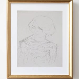 May include: A framed pencil sketch of a woman with short hair, set in a gold-colored frame. The artwork is a portrait with a soft, delicate style. The text "DESMITH DIGITAL PRINTS" is visible at the bottom.