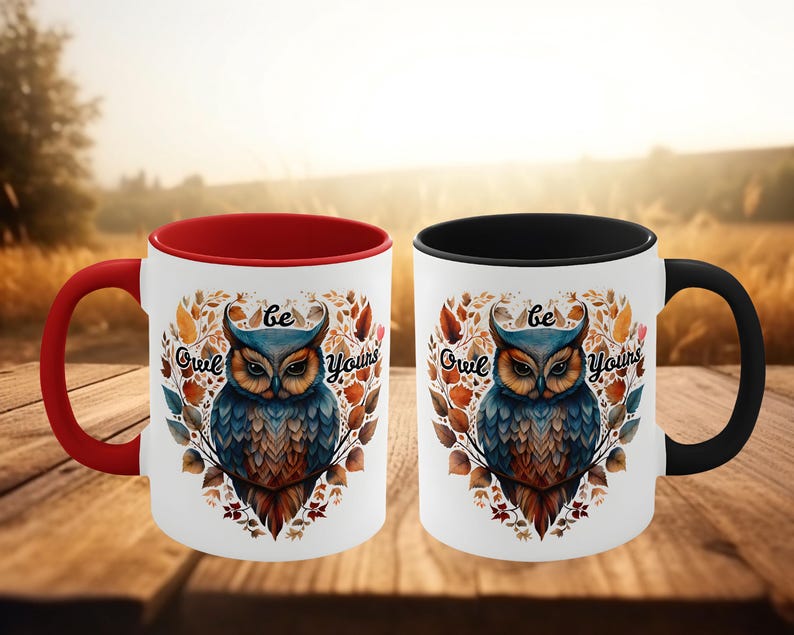 May include: Two white ceramic mugs with red and black rims. Both mugs feature a colorful owl illustration with the text "Be Owl Yours".