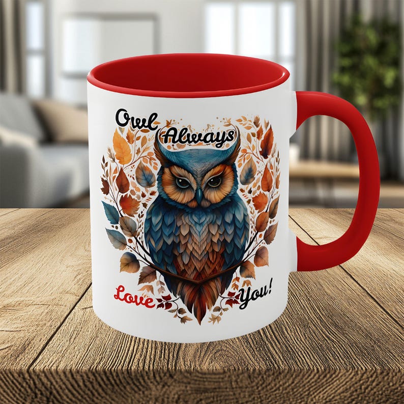 May include: White ceramic mug with a red interior and handle. The mug features a detailed illustration of an owl with blue, brown, and orange feathers, surrounded by autumn leaves. Text on the mug reads "Owl Always Love You!"