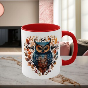 May include: White ceramic mug with a red rim and handle. The mug features a colorful illustration of an owl with the text "Be Owl Your Self" in a heart-shaped frame.