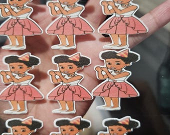 May include: A collection of stickers featuring a cartoon girl in a pink dress and a party hat. The stickers have a white top, a pink skirt, and white shoes. The girl is smiling and has dark hair.