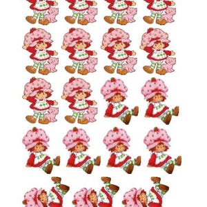 May include: A sheet of stickers featuring the character Strawberry Shortcake. Each sticker shows Strawberry Shortcake in a red dress, a pink bonnet, and green and white striped leggings, holding a pink pig.