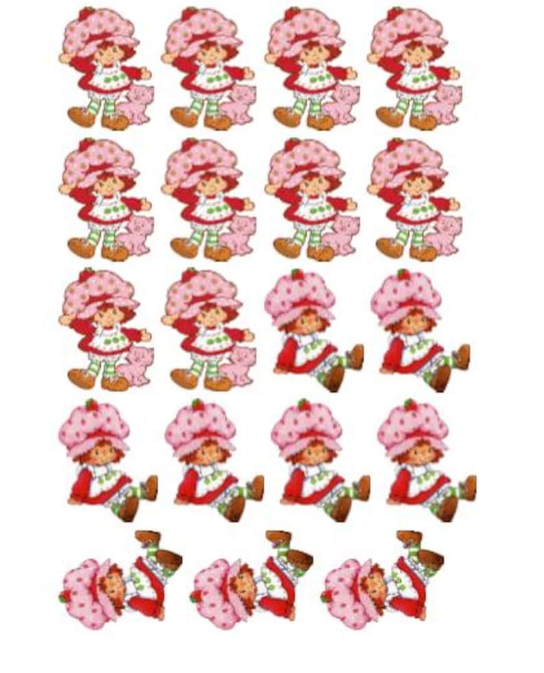 May include: A sheet of stickers featuring the character Strawberry Shortcake. Each sticker shows Strawberry Shortcake in a red dress, a pink bonnet, and green and white striped leggings, holding a pink pig.
