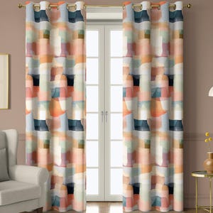 May include: Two colorful patterned curtains with a gold rod. The curtains feature an abstract design of overlapping shapes in shades of orange, blue, pink, and white. The curtains hang in front of a white door.