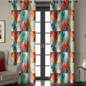 May include: A pair of vibrant geometric patterned curtains. The design features a repeating pattern of colorful diamond shapes in shades of red, orange, teal, and gold. The curtains are hanging in front of a glass door.