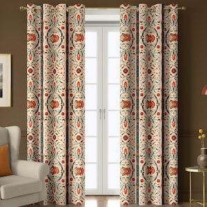 May include: Cream-colored floral patterned curtains with red and green accents. The curtains are hanging in front of a white door. The floral design includes stylized flowers and leaves. The curtains are made of a thick fabric.