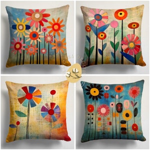 May include: Set of four colorful throw pillow covers featuring abstract floral designs. Each pillow cover has a different color scheme and pattern, with a mix of geometric shapes and organic forms. The pillow covers are made of a soft, durable fabric and are perfect for adding a touch of whimsy to any room.