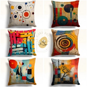 May include: Set of six colorful throw pillows with abstract geometric and circular patterns. The pillows feature a variety of colors, including red, yellow, blue, green, and black. The pillows are made of a soft, comfortable fabric and are perfect for adding a touch of style to any room.