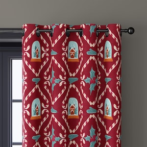May include: Red Christmas-themed curtain with a repeating pattern of white candy canes, snow globes, and holly leaves. The snow globes feature a small house inside. The curtain is hanging on a black rod.