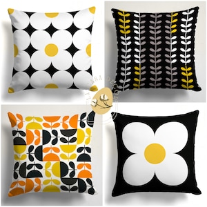 May include: Four different throw pillow designs featuring geometric patterns in black, white, yellow, and orange. The pillows are all square and have a white background.