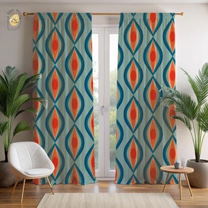 May include: A pair of retro-style curtains with a repeating pattern of vertical, teardrop-shaped designs in shades of teal, orange, and blue. The curtains are hanging in front of a window, with a white chair and plants in the foreground.