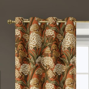 May include: Curtain with a floral pattern in orange, cream, and green. The design features large, stylized flowers and leaves. The curtain is suspended from a gold-coloured rod. The curtain is likely made of fabric.