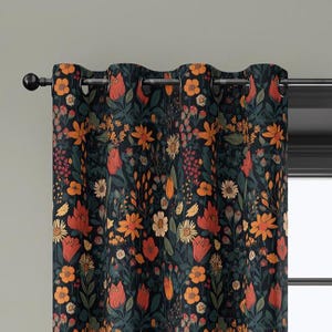 May include: Floral patterned curtain with a dark background. The design features orange, red, and yellow flowers with green leaves. The curtain is hanging on a black rod with metal grommets.