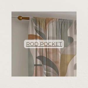 May include: A rod pocket curtain with an abstract leaf design in muted tones of green, gold, and pink. The curtain hangs from a gold-colored rod. The text "ROD POCKET" is visible on the curtain.
