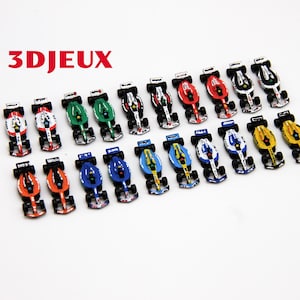 May include: A collection of miniature race cars in various colors, including red, green, blue, and yellow. Each car has a black cockpit and white accents. The logo "3D Jeux" is in red.