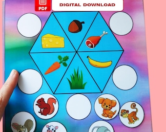 May include: A printable PDF worksheet for kids featuring a blue hexagon with images of a carrot, acorn, cheese, banana, grass, and a ham bone.  The hexagon is surrounded by eight circles, some with images of animals and some blank.  The text "DIGITAL DOWNLOAD" is printed in red at the top of the page.