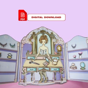 K&ouml;nnte beinhalten: Ein druckbarer PDF-Digitaler Download eines Papierpuppen-Spielsets mit einer Puppe in einem wei&szlig;en Kleid und einem Schminktisch mit Spiegel, Schubladen und Make-up-Accessoires.