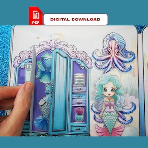 Puede incluir: Un juego de vestir de sirena descargable en PDF imprimible. El juego incluye una muñeca sirena, un pulpo y un armario con diferentes atuendos. El juego está diseñado para que los niños puedan jugar y divertirse.