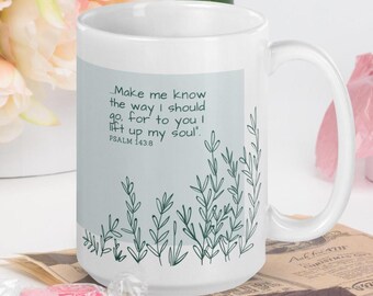 May include: White ceramic mug with a curved handle. The mug features a light blue rectangular design with the text "Make me know the way I should go, for to you I lift up my soul". Green leaf illustrations are also present.