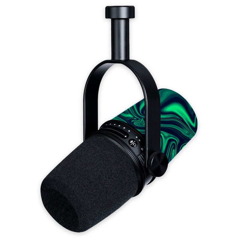 May include: A black professional microphone with a black foam windscreen. The microphone has a green and blue marbled pattern on the back and is suspended by a black bracket.
