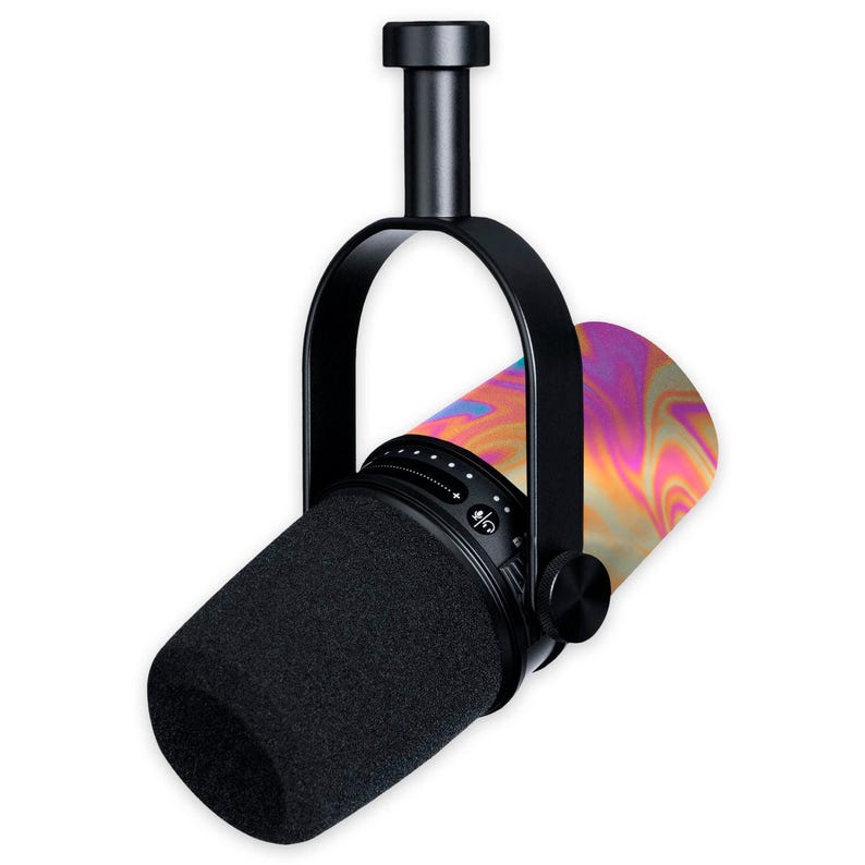 May include: A black professional microphone with a black foam windscreen. The microphone is suspended by a black bracket and has a colorful, swirling pattern on the body. The microphone is designed for recording and broadcasting.