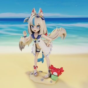 May include: A figurine of a girl with fox-like ears and long blonde hair, wearing a white sailor outfit with blue accents. She stands on a sandy base with a red crab and green bucket. The background shows a beach and ocean.
