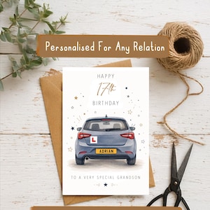 May include: A white birthday greeting card featuring a gray car illustration from the rear view. The card displays the text HAPPY 17th BIRTHDAY, a red L learner plate, and a yellow license plate reading ADRIAN. It includes the text TO A VERY SPECIAL GRANDSON.