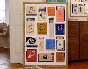 May include: A framed collage of 16 matchbox labels with various designs and text. The labels feature illustrations of a cocktail glass, a pair of feet, a skier, a hand holding a glass, a bottle of gin, a pool ball, a pair of legs, a dice, and a spade playing card. The text on the labels includes "CHEERS", "OFFICE", "LIFE IS FANTI", "CINCIN", "LONG LIVE COWGIRLS", and "SS LUCKY".