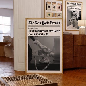 May include: A black and white newspaper print with the headline "The New York Trends" and the text "REMINDER: In this Bathroom, We Don't Drunk Call Our Ex". The image shows a hand reaching for a vintage rotary phone.