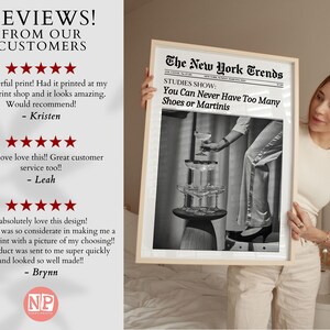 May include: A framed black and white photograph of a woman holding a glass of champagne. The photo is titled "The New York Trends" and has the text "STUDIES SHOW: You Can Never Have Too Many Shoes or Martinis".