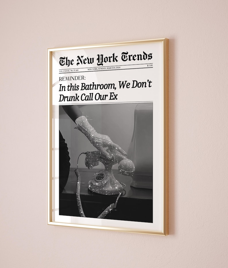 May include: A black and white photograph of a hand reaching for a rotary phone. The photo is printed on a newspaper with the headline "The New York Trends" and the text "REMINDER: In this Bathroom, We Don't Drunk Call Our Ex".