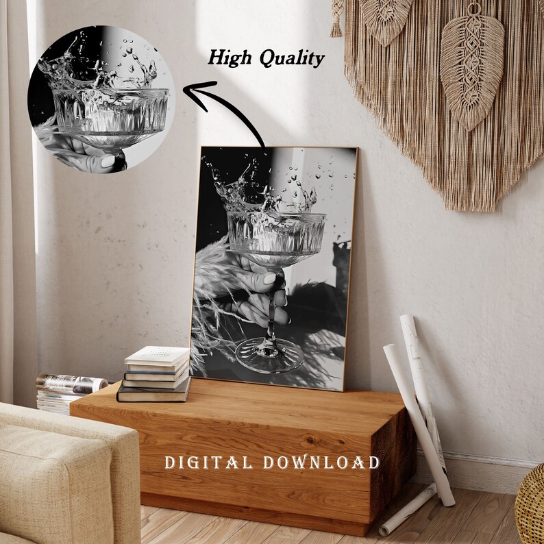 May include: Black and white digital download print of a glass of water with a splash of water coming out of the glass. The glass is being held by a hand. The background is a blurry image of a person's hand and a shadow.
