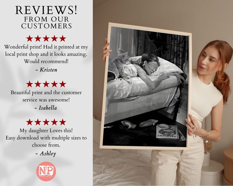 May include: Black and white photo print of a woman sleeping in bed with a cat. The print is framed and being held by a person. The photo is accompanied by customer reviews praising the quality of the print and the customer service.