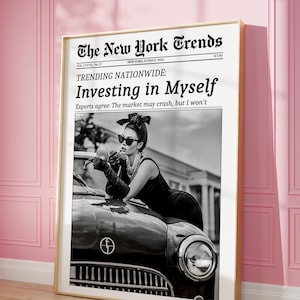 May include: A framed black and white print of a newspaper front page titled "The New York Trends." The headline reads "Investing in Myself." The image features a woman leaning on a vintage car.
