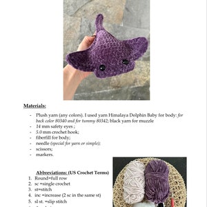 May include: Purple crocheted amigurumi Pacific disc ray with black safety eyes. The amigurumi is being held by a hand. The image also shows the materials needed to make the amigurumi, including yarn, a crochet hook, fiberfill, a needle, scissors, and markers.