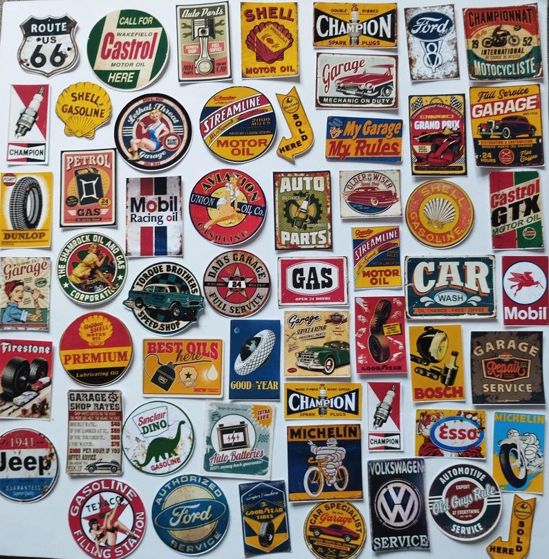 May include: A collection of assorted vintage-style automotive stickers featuring various logos, signs, and illustrations related to motor oil, tires, spark plugs, and classic car brands, displayed in a grid-like arrangement on a white background.