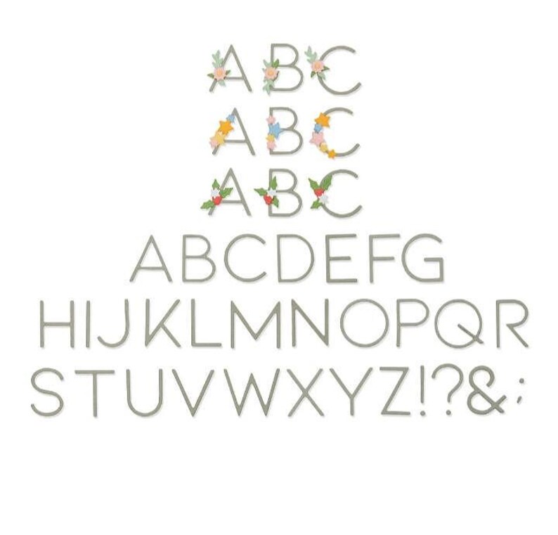 May include: A collection of gray letter and number cutouts. The letters "ABC" are decorated with floral and star accents. The full alphabet, numbers, and punctuation are displayed in a simple, sans-serif font.