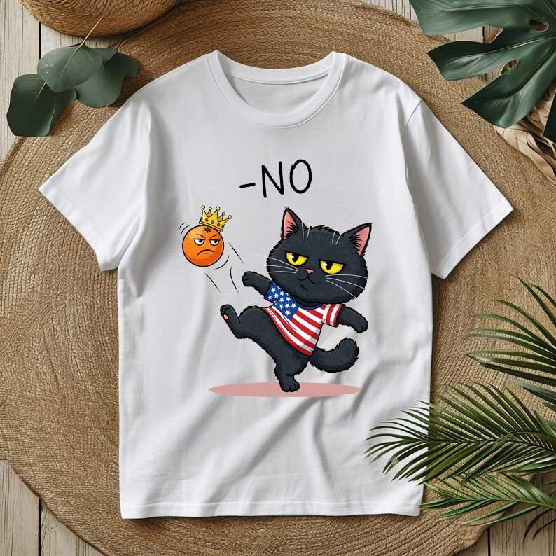 May include: White t-shirt featuring a cartoon black cat kicking an orange emoji wearing a crown. The cat is wearing a shirt with an American flag design. The word "-NO" is printed above the cat.